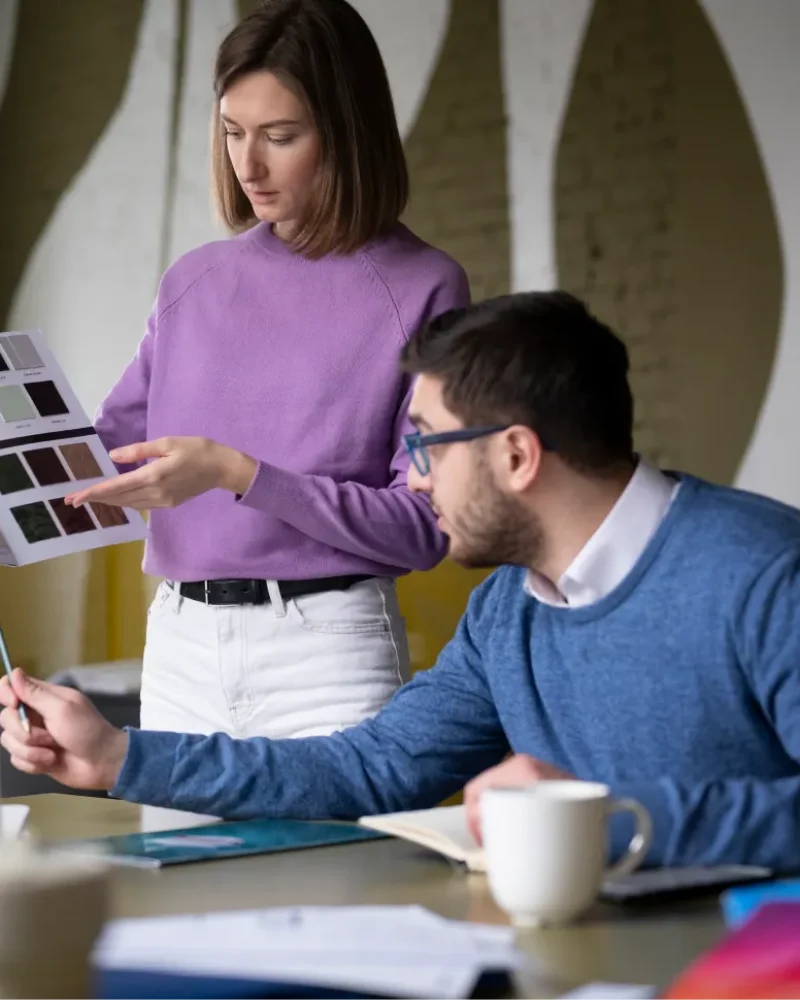 medium-shot-colleagues-picking-colors 1